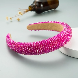 Detailed view of pink crystal headband with sparkling rhinestones and non-slip inner lining