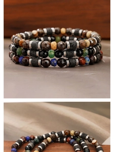 Macro detail of layered natural stone bracelets with volcanic rock and colorful beads
