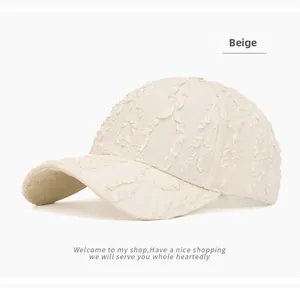 Detail view of the beige bubble gauze texture and pleated fabric on the baseball cap