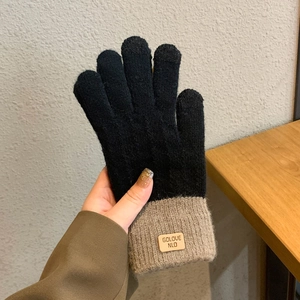 Winter thermal touchscreen gloves in black knit with beige ribbed cuffs and leather label