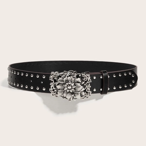 Fashionable black studded punk belt with a large ornate silver floral buckle for women