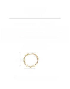 Detail showing OT toggle clasp and square cubic zirconia on a gold chain bracelet
