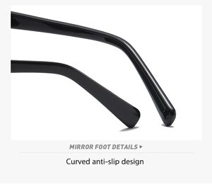 Detail view of the curved anti-slip mirror foot design on glossy black sunglasses