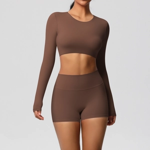 Detail view of coffee brown two-piece yoga set with long sleeve crop top and shorts