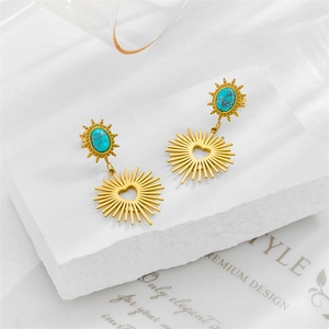 Vintage style gold sun heart earrings with turquoise stone on stone pedestal