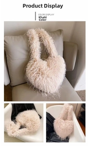 Detail view of khaki heart-shaped faux fur crossbody bag with soft plush shoulder strap