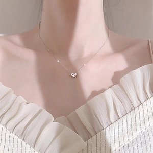 Elegant silver heart pendant necklace for women shown on neck for fashion styling