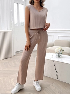 Close-up of apricot ribbed knit fabric on casual two-piece lounge set with drawstring