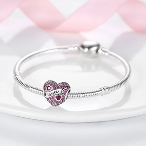 Silver bead bracelet with a pink gem heart pendant engraved with Sister text