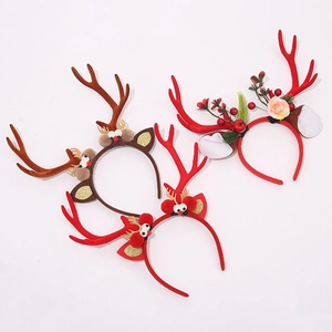 Three assorted Christmas reindeer antler headbands with plush ears and floral accents