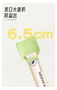 Detail of pet feeding spoon for cat treats with 6.5cm wide opening in light green color