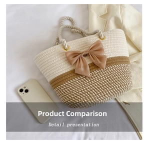 Detail view of woven tote bag with large satin bow and twisted rope handle on white fabric