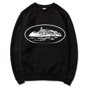 Detail of a black crewneck sweatshirt featuring a white oval graphic of an island fortress