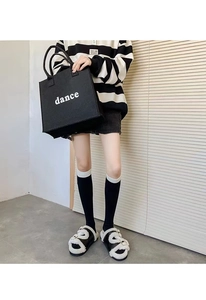 Large black felt tote bag with dance typography shown in a lifestyle indoor setting