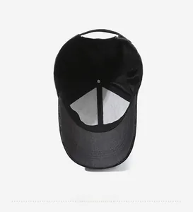 Internal view of black baseball cap showing breathable mesh lining and adjustable strap