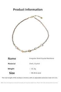 Detailed view of pink crystal bead necklace with irregular white shell charms and gold clasp