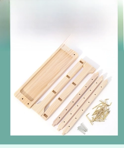 Detail view of solid wood jewelry stand parts including base, beams, and golden hooks