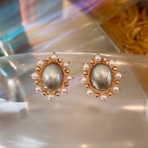 French vintage oval pearl earrings with gold beads and silver needle studs in retro style