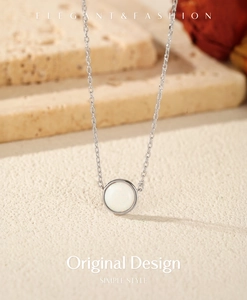 Elegant silver S925 sterling silver necklace with white opal pendant on a beige background
