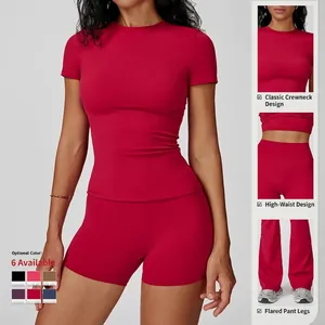 Red slim-fit yoga set with round neck t-shirt and high-waisted flared workout shorts