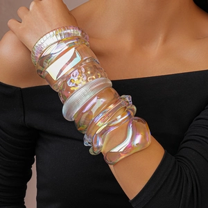 Iridescent acrylic geometric bracelets with colorful rainbow refraction effects on a model