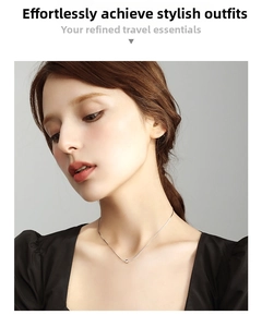 Minimalist silver steel beaded necklace on model neck showing subtle geometric pendant detail