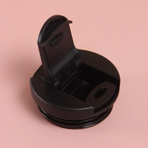 Close-up of black plastic flip lid with sealing screw thread for coffee travel mug
