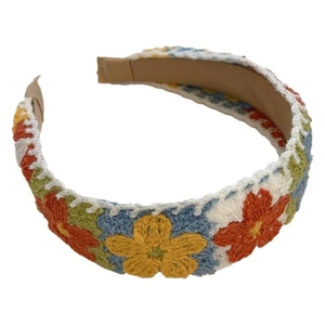 Handmade crochet floral headband with colorful flower embroidery on white fabric base