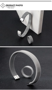 Detail shot of silver mesh stainless steel cuff bracelet and matching industrial style ring