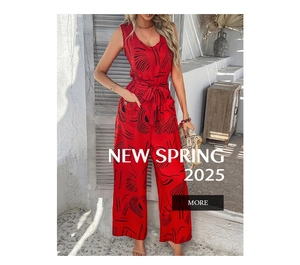 Detail of red floral wide-leg jumpsuit with deep V-neck and belt in Mediterranean setting