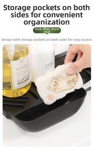 Macro detail of black silicone kitchen faucet splash guard with integrated soap holder