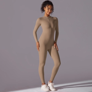 Detail of high-stretch khaki yoga bodysuit featuring a front zipper and stand collar