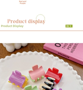 Mini candy-colored hair claw set in vibrant contrast colors on a white ceramic plate
