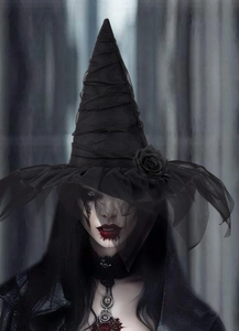 Detail of gothic witch hat with black roses and mesh veil for Halloween costume