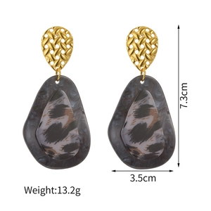 Detail view of geometric leopard print earrings with size specs 7.3cm height and 3.5cm width