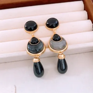 Vintage water drop flower beaded earrings with black stone inlay in a light luxury jewelry box