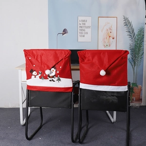 Close-up of festive Christmas chair covers with snowman and penguin patterns for party decor