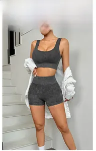 Detailed ribbed texture of charcoal grey yoga set including sports bra and high waist shorts