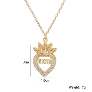 Detailed view of gold MOM heart pendant with crown design and size measurements