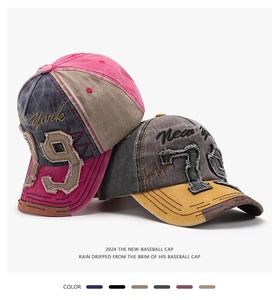 Detailed view of two vintage distressed baseball caps with unique embroidery patches.