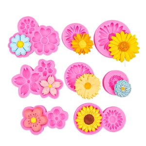 Detail showing pink silicone flower molds and finished clay sunflower and daisy crafts