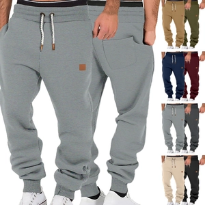 Detail view of men's casual joggers showing elastic waistband and multiple color options
