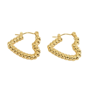 Detail of gold heart-shaped hoop earrings with intricate twisted rope texture