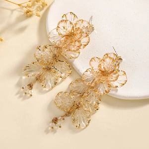 Elegant floral tassel earrings featuring transparent resin petals and gold metallic accents