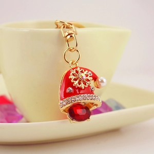 Charming red enamel Christmas hat keychain with crystals and gold snowflake accents