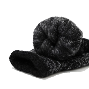 Close-up of winter knit beanie with thick black fleece lining and grey marl texture