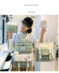 Detailed set of five nylon school bags featuring green plaid design and bear charm