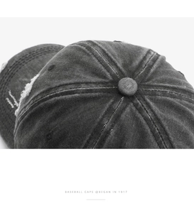 Detailed macro view of washed vintage baseball cap with distressed brim and stitching details