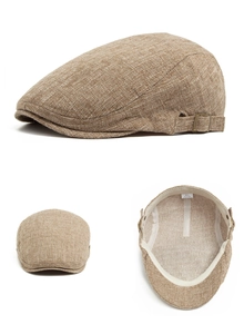 Detail view of khaki cotton linen flat cap showing breathable texture and brass buckle
