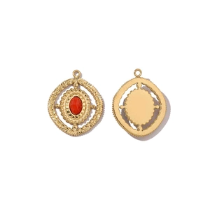 Front and back detail of gold stainless steel heart pendant with red stone inlay